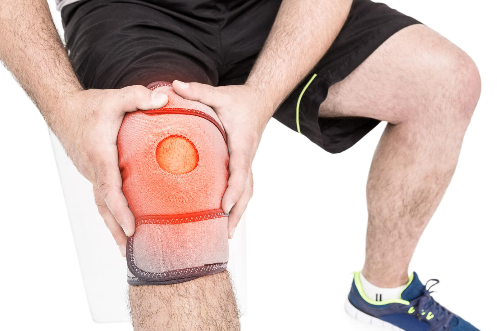 Man suffering with knee inflammation with knee brace