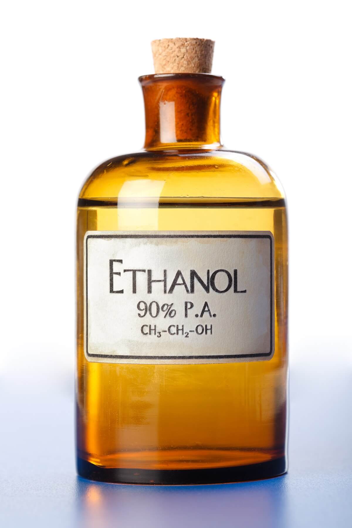Ethanol, pure ethyl alcohol in bottle — Photo. Glass bottle with ethanol with cork stopper.