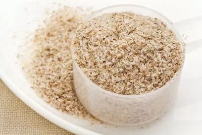 measuring plastic scoop of psyllium seed husks - dietary supplement, source of soluble fiber